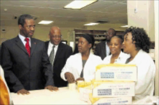 MAKING ROUNDS: KwaZulu-Natal MEC for health Sibongiseni Dhlomo listens to Gladys Shazi and Zippora Gumede's problems at the Addington Hospital pharmacy. PiC: THEMBA MNGOMEZULU. 14/07/2009. © Sowetan.