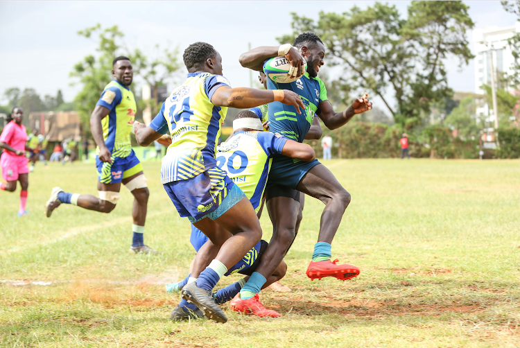 Menengai Oilers' defence in action against KCB's Johnstone Olindi during a recent match