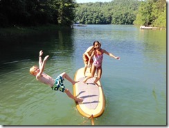 Will, Alex, Madison on surfboard