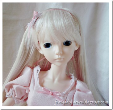 Ball Jointed Doll Wearing a Pink Dress