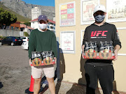 Students Jeremy Ives and James Stachen stock up on booze supplies at the Tops Spar in Vredehoek.