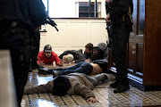 Trump supporters are detained by Capitol police in the U.S. Capitol in Washington, D.C., U.S., on Wednesday.