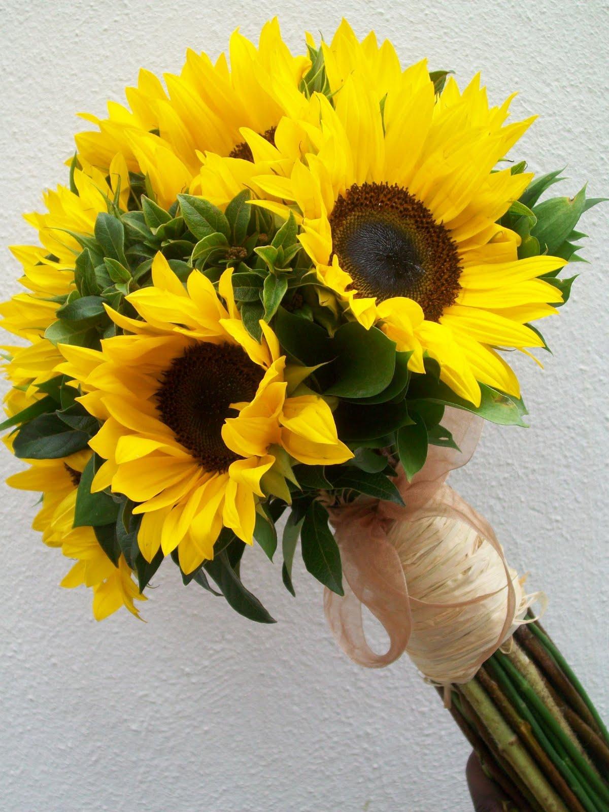 sunflowers is the first thing that came to mind! You can add satin ribbon to