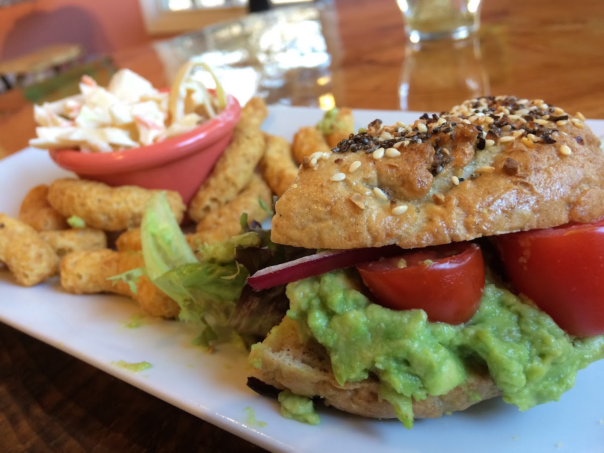 Avocado and tomato on a yummy toasted sesame bagel.