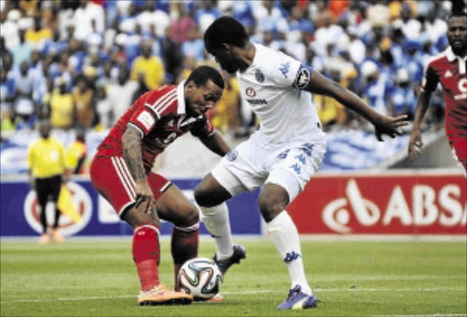 NO HOLDING BACK: Kermit Erasmus of Orlando Pirates, left, is confronted by Thabo September of SuperSport United during Sunday's Absa Premiership match Photo: Philip Maeta/Gallo Images