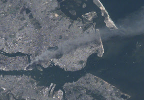 A zoomed in view of the World Trade Center site as seen by astronauts on board the International Space Station on September 11, 2001.  (NASA)  Click the image for a larger view.