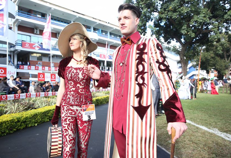 Leandi and Wayne Redgard wear designers by Brenda Warring at the Durban July.