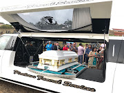 Mourners gather alongside the white coffin bearing the body of Sadia Sukhraj at the Christian Revival Centre in Chatsworth on May 29, 2018.