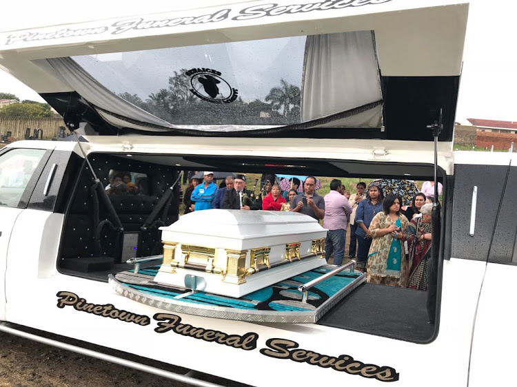 Mourners gather alongside the white coffin bearing the body of Sadia Sukhraj at the Christian Revival Centre in Chatsworth on May 29, 2018.