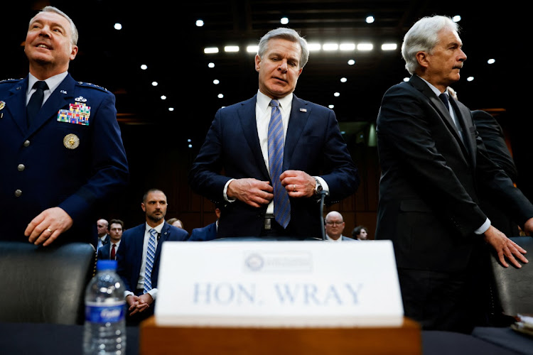 FBI director Christopher Wray, CIA director William Burns and Defense Intelligence Agency director Air Force Lt Gen. Jeffrey Kruse prepare to testify in Washington, the US, March 11 2024. Picture: REUTERS/Julia Nikhinson