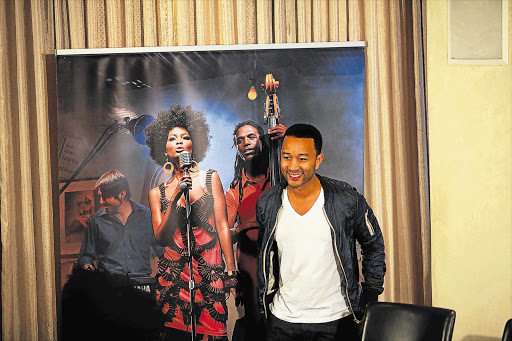 Singer John Legend talks to journalists at Melrose Arch, in Johannesburg, yesterday. He is to perform one concert tonight Picture: ALON SKUY