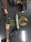 A rhino horn and rifle were seized.