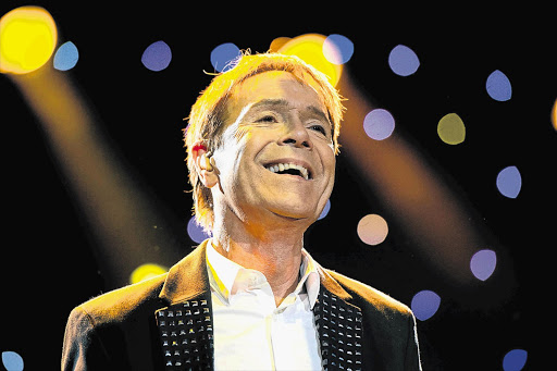 PETER PAN OF POP: British singer Cliff Richard during a concert in Amsterdam earlier this year. After searching his house yesterday, police reportedly removed items for further investigation, but no arrests have been made