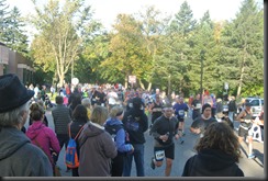 The spectators grow!   Spilling out into the road!