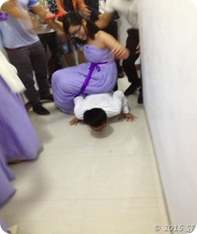 A bridesmaid sitting on the Groom's back