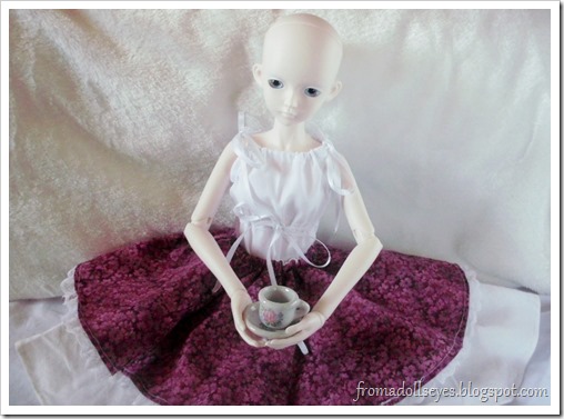 bjd drinking tea in red and off-white skirt