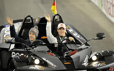 Себастьян Феттель и Михаэль Шумахер за рулями болида KTM на Гонке чемпионов 2011