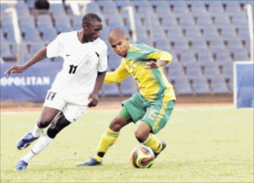 Evans Musonda of Zambia fight for the ball with Keagan Buchanan of South Africa during the Metropolitan COSAFA under 20 youth championship at Dobsonville Stadium. Zambia beat South Africa 1-0.Pic: Veli Nhlapo. 15/12/2009. © Sowetan.