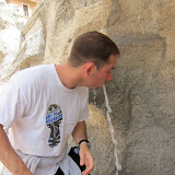 Drinking from the Trevi Fountain.  Still in the same clothes.