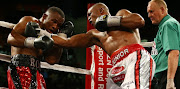 Thabiso 'The Rock' Mchunu, right, and Ilunga 'Junior' Makabu during the WBC Eliminator bout on May 16, 2015 in Durban. Makabu will not be defending his title. 