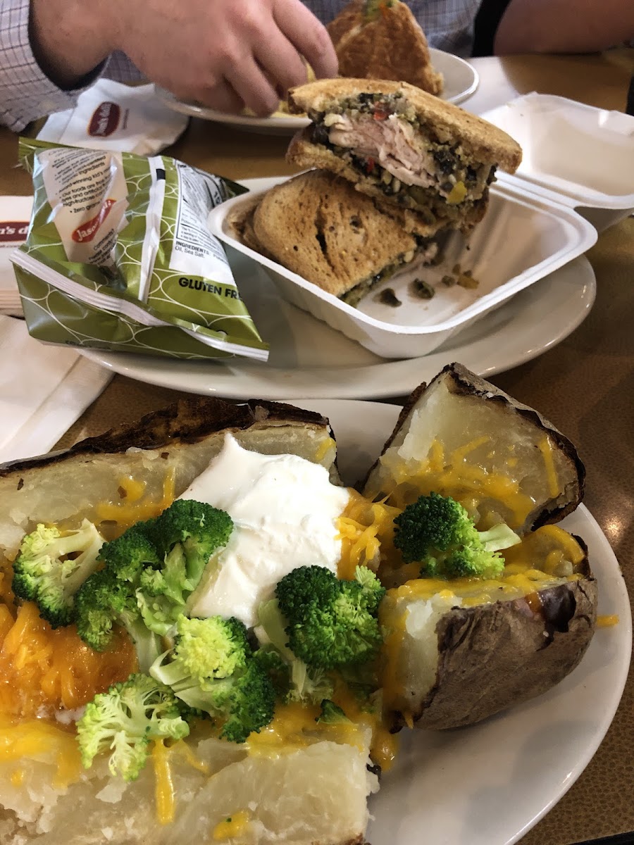 My muffetta on GF bread with a baked potato that has cheese, butter, sour cream, and broccoli as toppings. (The broccoli soup is not GF so this was an alternative suggested by a staff member).