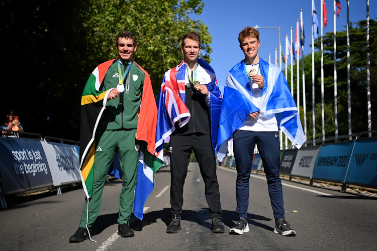 Silver medallist Daryl Impey of Team SA, gold medallist Aaron Gate of Team New Zealand and bronze medallist Finn Crockett of Team Scotland stand together with their medals after the men's road race ceremony at the Birmingham 2022 Commonwealth Games in England, August 7 2022. Picture: JUSTIN SETTERFIELD/GETTY IMAGES