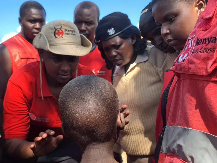 Kenya Red Cross rescues a child marooned by floodwaters in Katangi, Machakos County on April 23, 2024.
