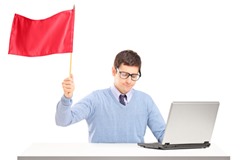 Sad man waving a red flag gesturing defeat