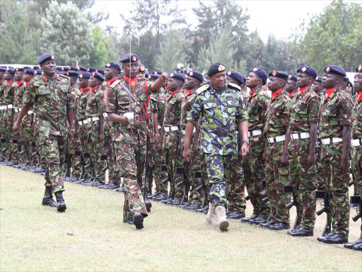 President Uhuru Kenyatta inspects a guard of honour mounted by the Kenya Defence Forces (KDF) during KDF day at the 3KR Lanet. Photo/File