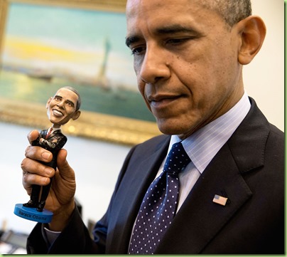 President Barack Obama holds a bobblehead doll of himself in the Outer Oval Office, May 14, 2014. (Official White House Photo by Pete Souza)
<p>This official White House photograph is being made available only for publication by news organizations and/or for personal use printing by the subject(s) of the photograph. The photograph may not be manipulated in any way and may not be used in commercial or political materials, advertisements, emails, products, promotions that in any way suggests approval or endorsement of the President, the First Family, or the White House.