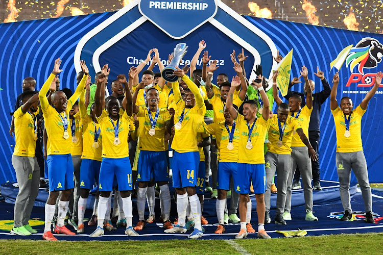Mamelodi Sundowns celebrate with the DStv Premiership trophy after their match against Royal AM at Chatsworth Stadium on May 23 2022. Downs are cruising to their sixth title in succession in 2022-23, raising questions over the competitiveness of the league.