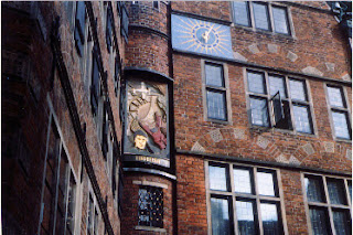 Glockenspiel with rotating pictures when the clock strikes.  Böttcherstraße, the old commerce district, downtown Bremen, Germany.