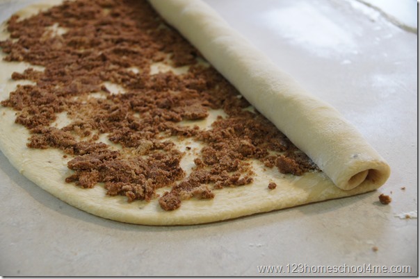 carefully start rolling up the dough carefully start rolling up the dough