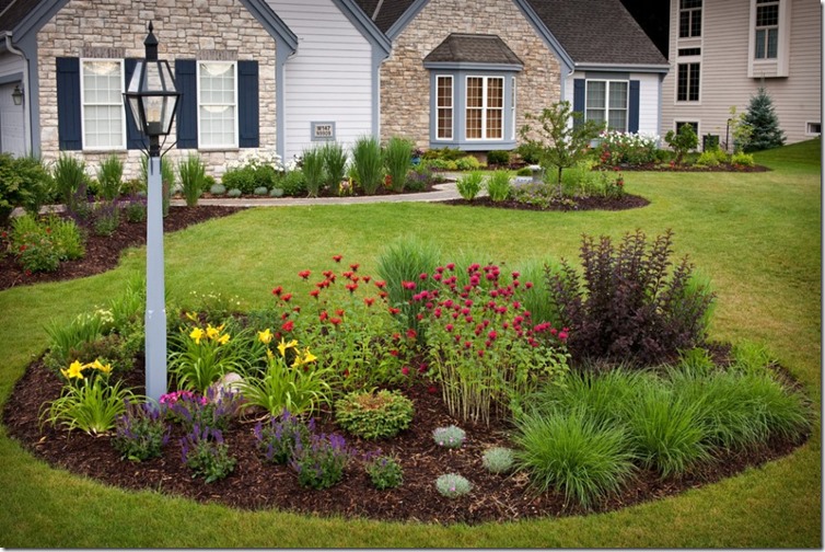 curb-appeal-and-garden-ideas-with-landscape-design-also-bee-balm-plus-blue-shutters-and-stone-starck-for-exterior-ideas-plus-flower-bed-also-fountain-grass-in-front-yard-for-stone-house-945x630