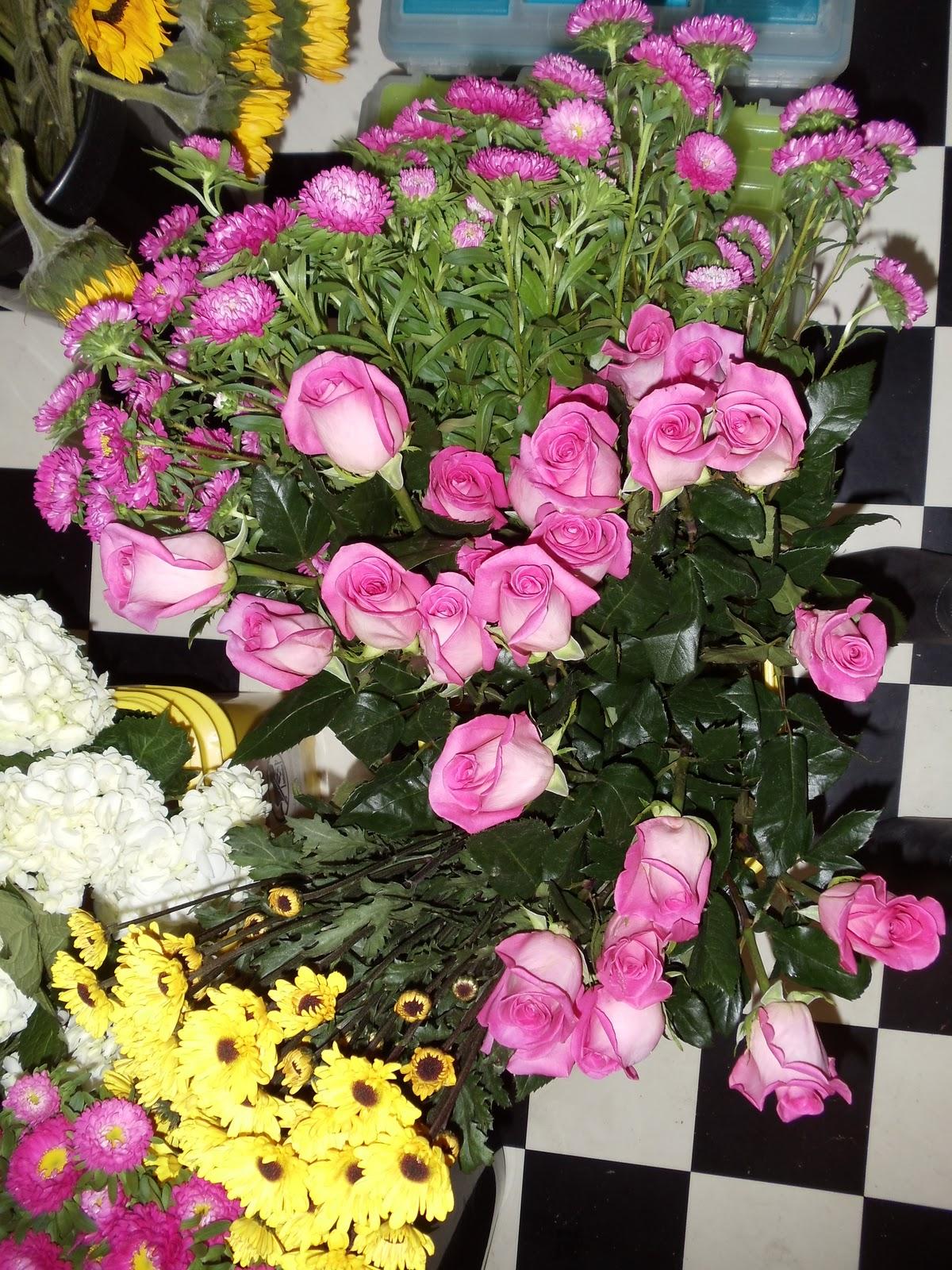 Pink roses, asters and yellow