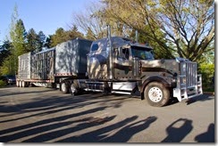 Elephants Chai and Bamboo leave the Woodland Park Zoo in windowless crates strapped on a flatbed trailer on Wednesday, April 15, 2015. Alyne Fortgang, co-founder of Friends of Woodland Park Zoo Elephants and the Elephant Justice Project, and advocates hoping the elephants would go to a sanctuary, and zoo personnel stood by to watch the departure of female Asian elephants Chai, 36, and Bamboo.Fortgang has been advocating to send the elephants to a sanctuary for nine years.  After the death of Watoto last year, the Woodland Park Zoo decided to close their elephant program and send them to the Oklahoma City Zoo.