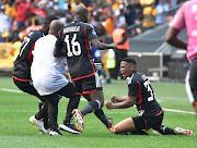 Thabiso Lebitso of Orlando Pirates is joined by fellow players and a Bucs medical official to celebrate his goal against Kaizer
Chiefs at FNB Stadium on Saturday.