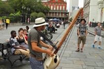 New Orleans Street Musician playing Kora African Base Harp