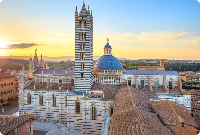 Siena sunset panoramic view. Cathedral Duomo landmark. Tuscany, Italy.