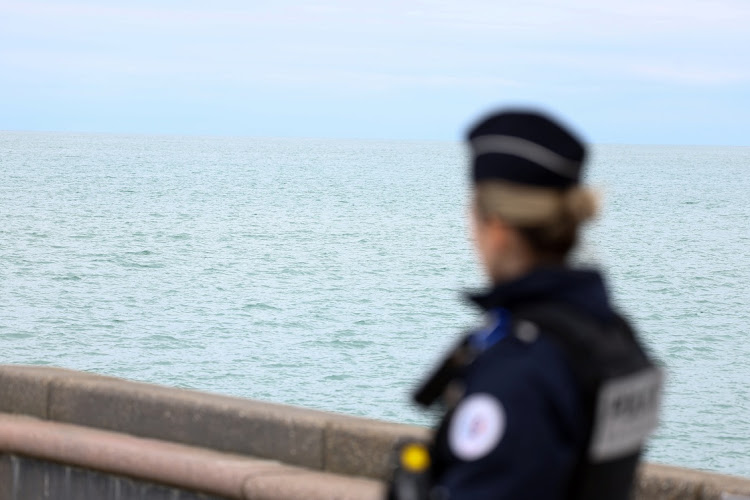 A police member looks on in Wimereux, near Calais, after migrants died in an attempt to cross the English Channel, in France, on April 23 2024.