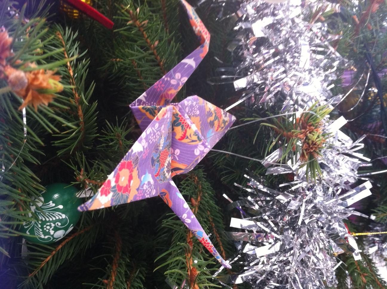 Professional tree decorations. Origami birds look fab hung from a Christmas