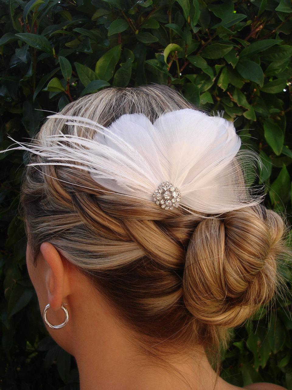 White peacock feathers, white