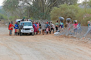 Zimbabweans who crossed illegally into SA to shop for groceries load up and cross back into their country using one of many wide gaps in the  expensive Beitbridge border fence. The SIU says it has succeeded in stopping further payments to two contractors who were awarded tenders to refurbish the fence.