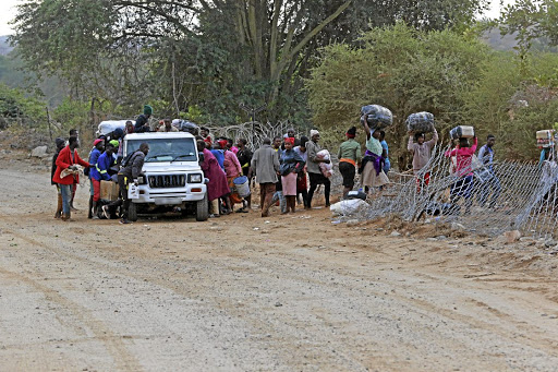 Zimbabweans who crossed illegally into SA to shop for groceries load up and cross back into their country using one of many wide gaps in the expensive Beitbridge border fence. The SIU says it has succeeded in stopping further payments to two contractors who were awarded tenders to refurbish the fence.