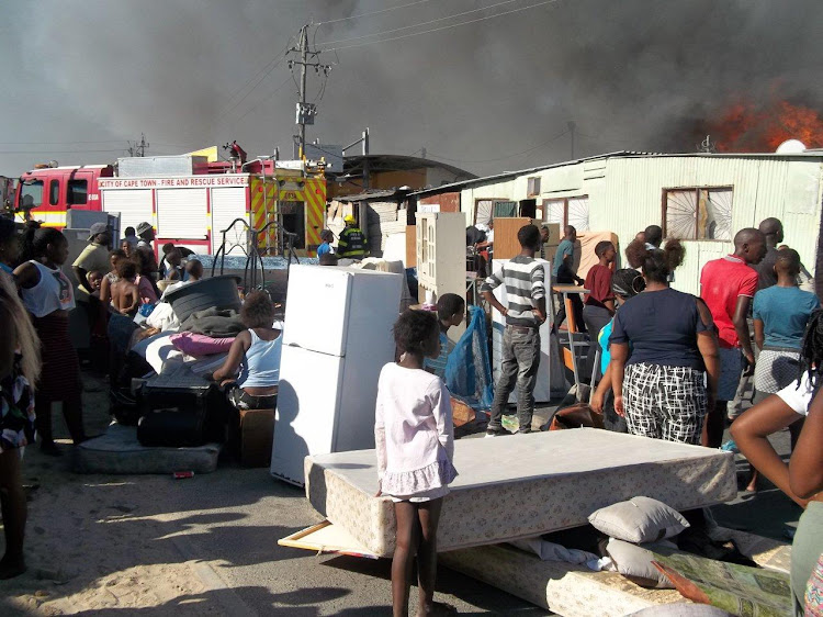 Residents struggled to save their belongings from the flames.