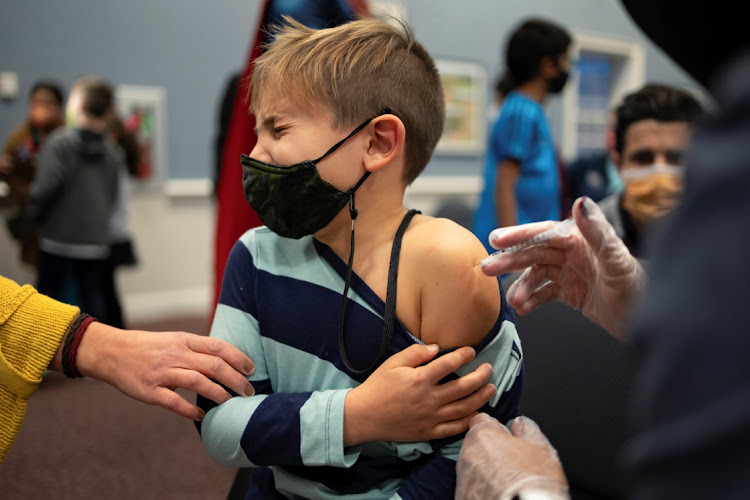 Levi Forst, 7, receives the Pfizer-BioNTech coronavirus disease (Covid-19) vaccine in Skippack, Pennsylvania, US, November 3, 2021.