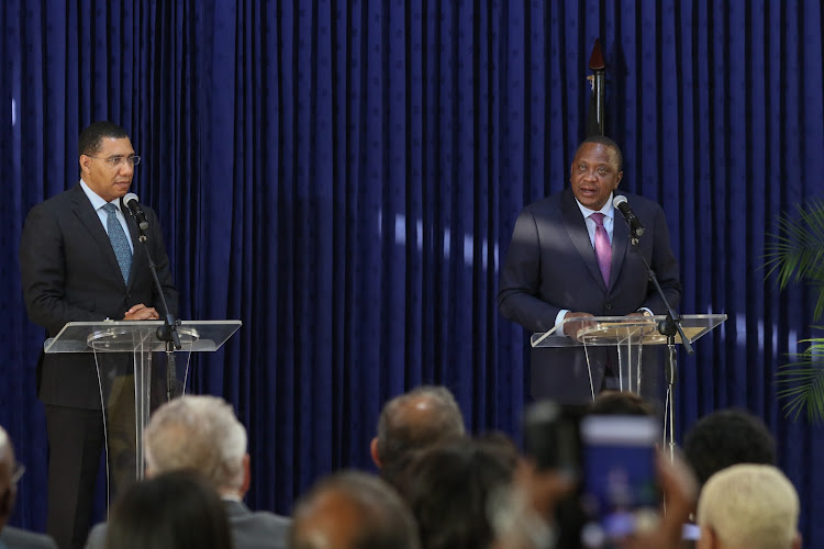 President Uhuru Kenyatta and Jamaican Prime Minister Andrew Holness hold a joint press briefing at the Jamaican Prime Minister's Office in Kingston, Jamaica, on Tuesday, August 6, 2019.