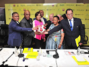 (From L-R): Fikile Mbalula, Tokyo Sexwale, Precious Moloi-Motsepe, Mamelodi Sundowns' owner Patrice Motsepe, Director of La Liga Africa Antonio Barradas, Sports Minister Tokozile Xasa and SA Football Association president Danny Jordan,during the Mamelodi Sundowns and The Motsepe Foundation press conference at Sandton Convention Centre, Johannesburg on May 10 2018.