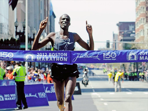 Wesley Korir of crosses the finish line as the winner of the 116th Boston Marathon in Boston, Massachusetts, USA, 16 April 2012. /EPA