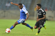 Onismor Bhasera (L) battles for the with Thembinkosi Lorch during the Absa Premiership match between Orlando Pirates and SuperSport United at Orlando Stadium in Johannesburg, South Africa. 
Image by: Lefty Shivambu/Gallo Images